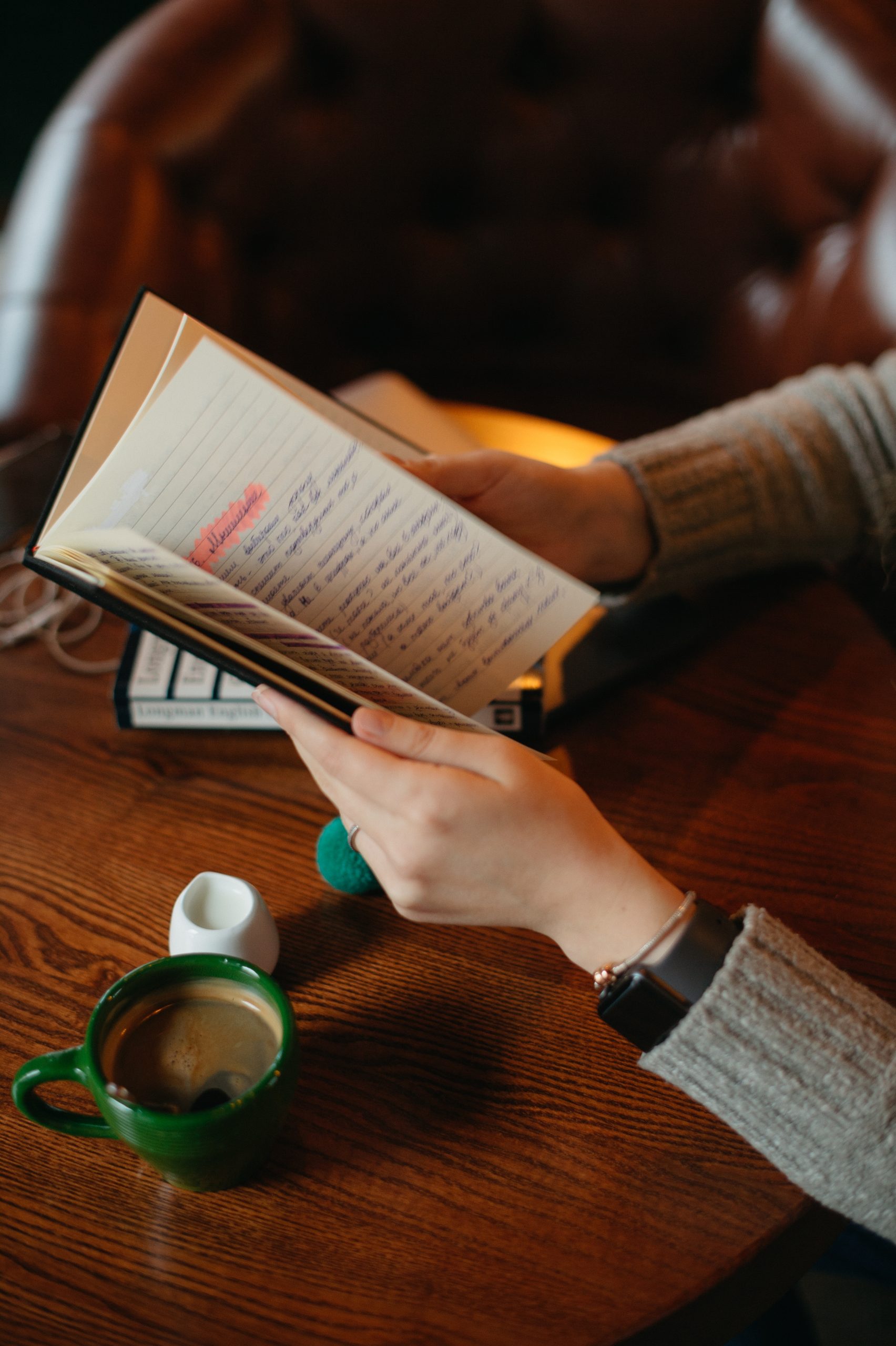 hands-holding-notebook-in-the-cafe-with-coffee-on-2024-11-26-04-04-52-utc